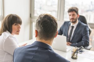 businessman-businesswoman-sitting-front-manager-workplace (1)